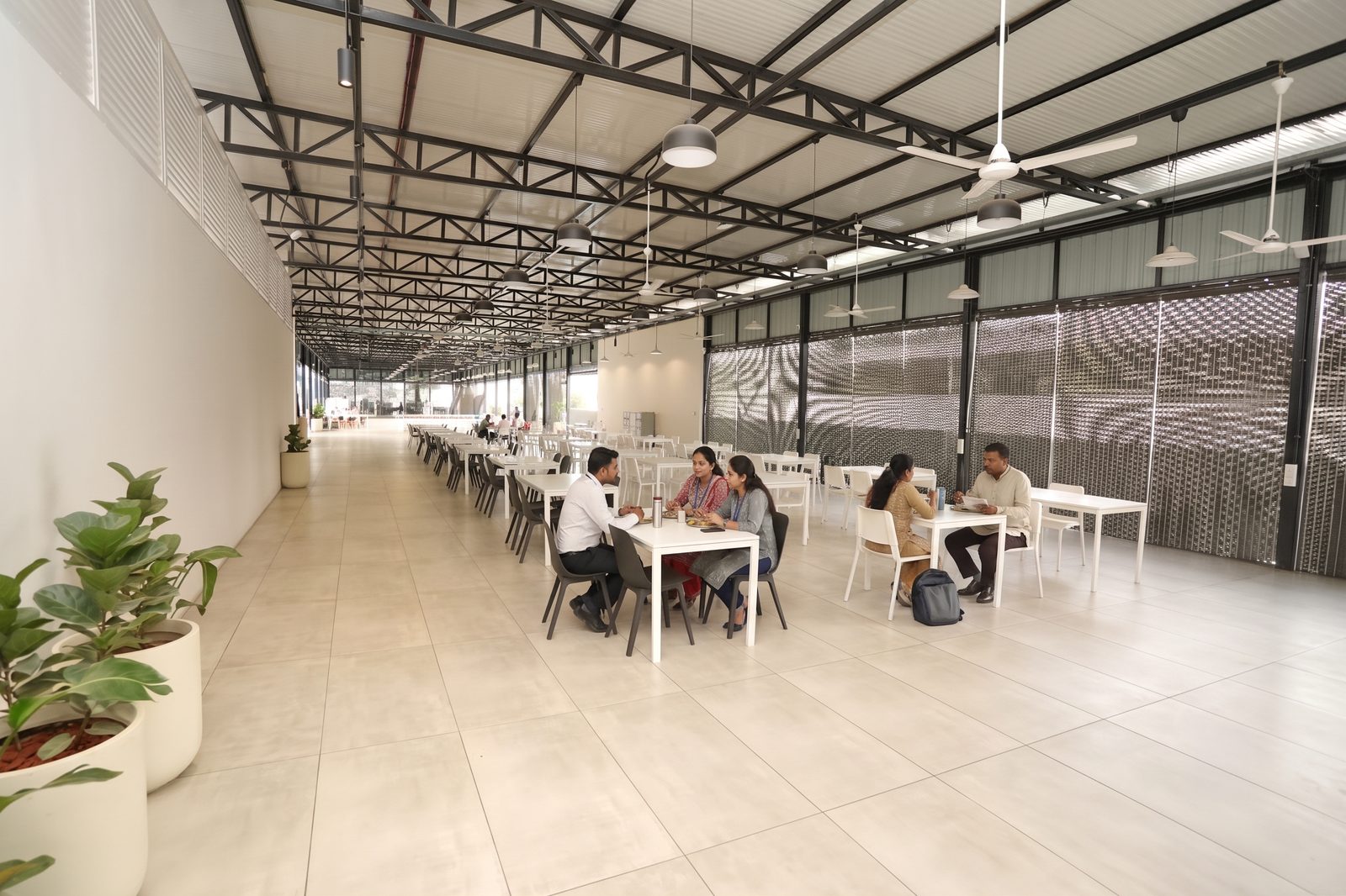 BHIVE cafeteria hall with communal dining tables