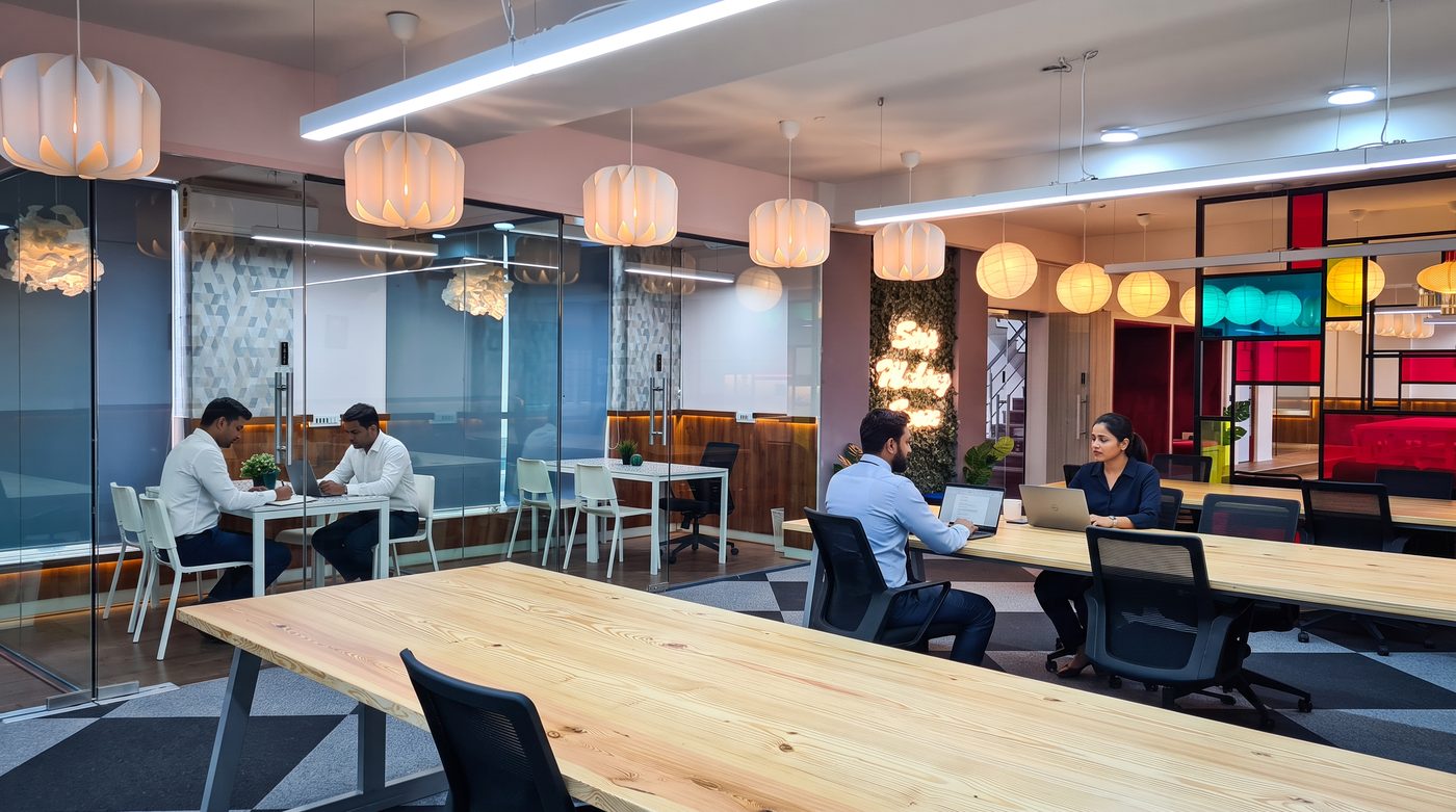 Glass-walled breakout pods at a BHIVE centre