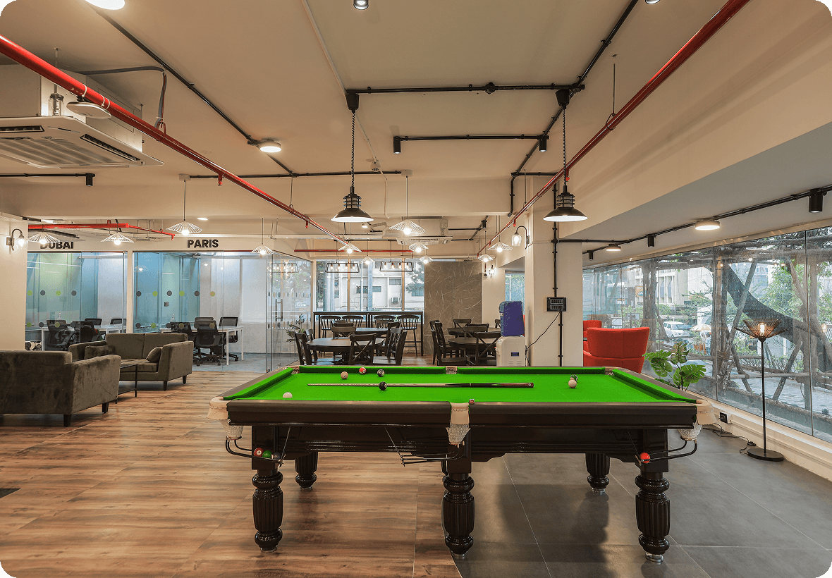 Collaboration lounge with pool table and meeting rooms at BHIVE